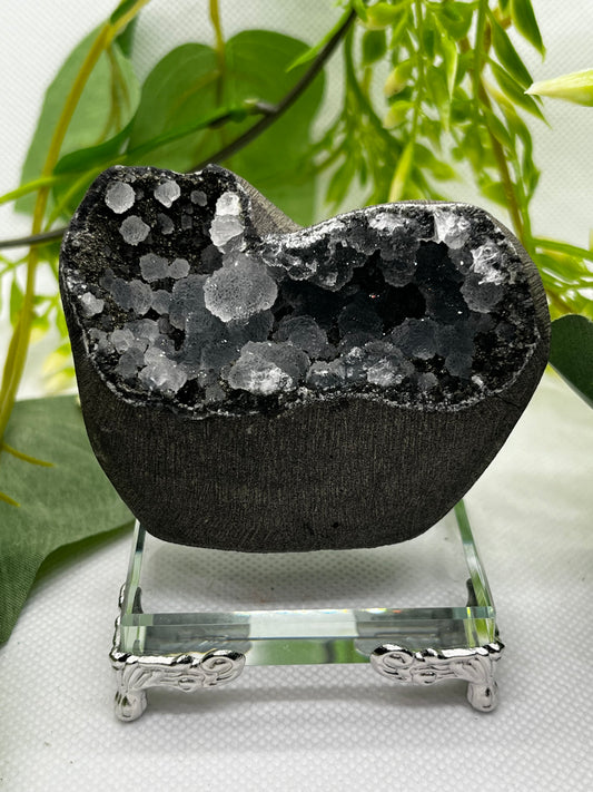 Calcite on black chalcedony geode D