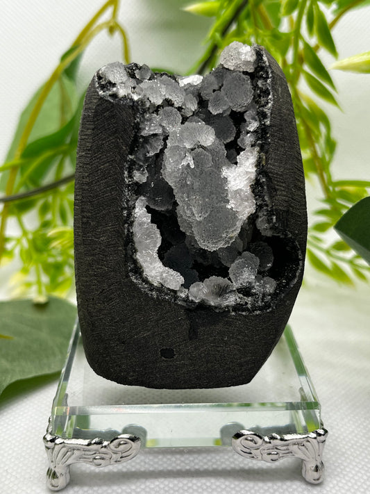 Calcite on black chalcedony geode F