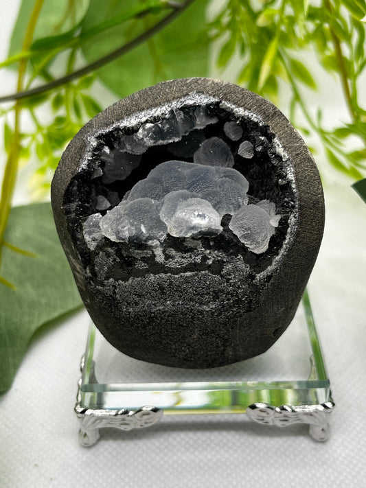 Calcite on black chalcedony geode H